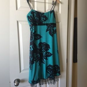 Green and black cocktail dress.